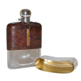 glass and silver hip flask