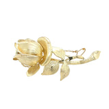 Yellow gold rose brooch. The petals and leaves have a rich texture to the gold. With safety chain.