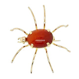 18ct Yellow gold 'spider' brooch with an oval cornelian set to the body of the spider.